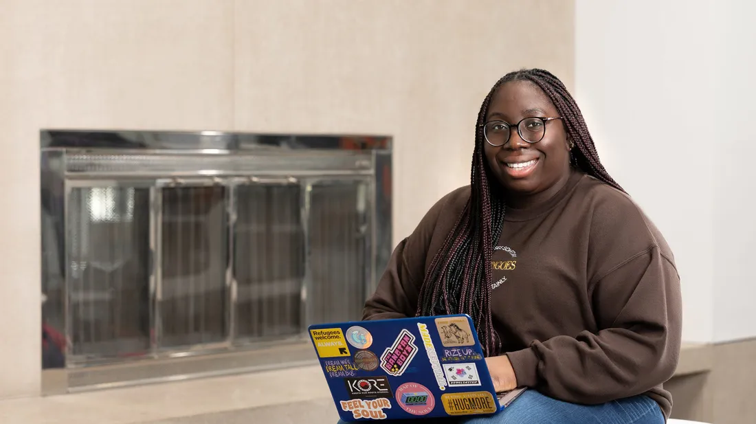 Magazine journalism major student sitting and working on computer.