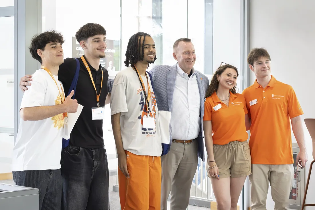 CeCe Stampas and other students standing with Chancellor Mike Haynie.