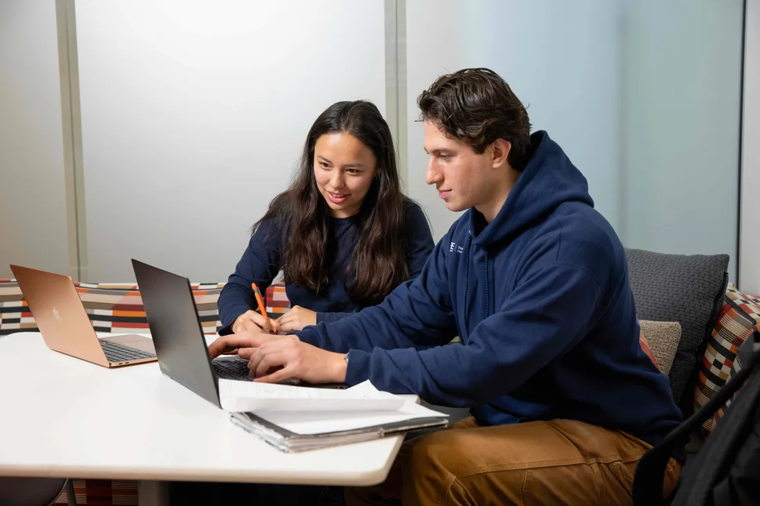 Two students study in the newly renovated Campos Student Center in the Center for Science and Technology.