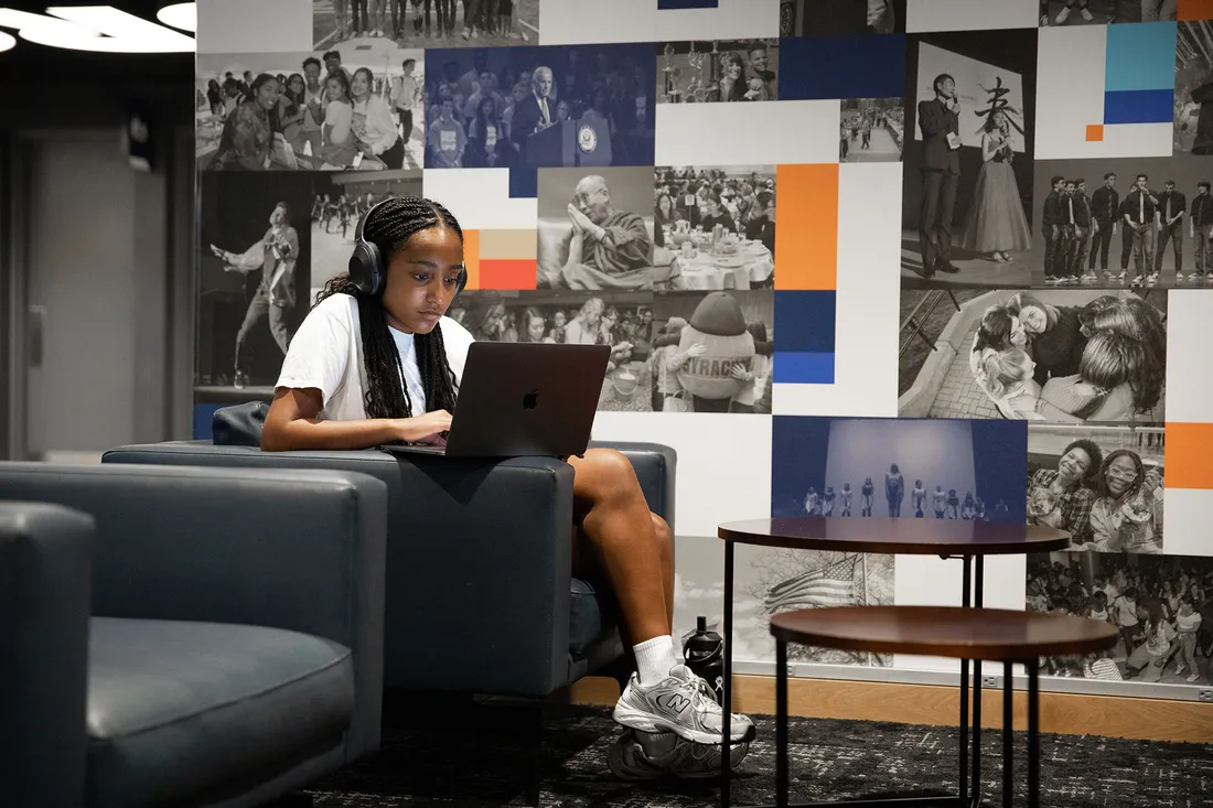 Student on laptop studying.