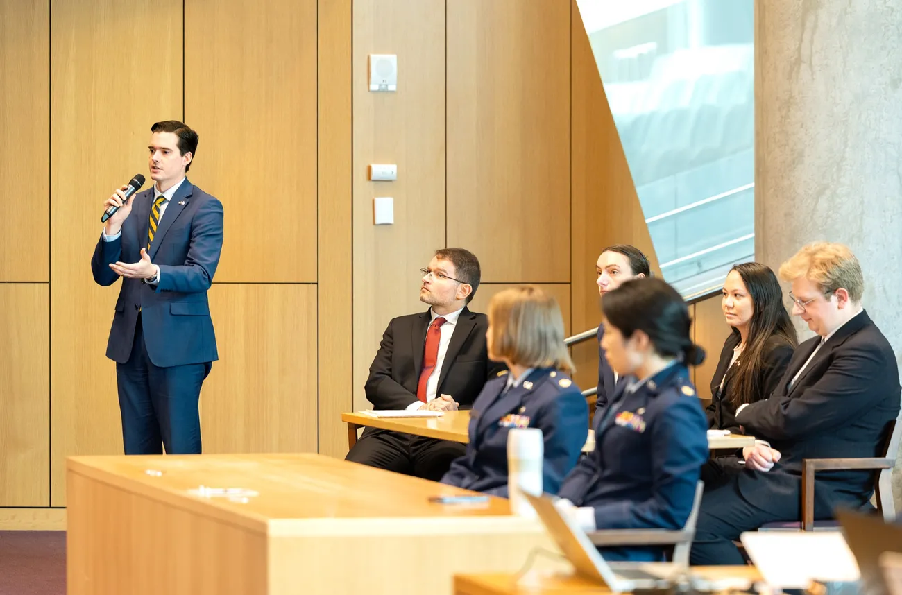 Person speaking at a courtroom hearing for the U.S. Air Force Court of Criminal Appeals at Syracuse University's College of Law.