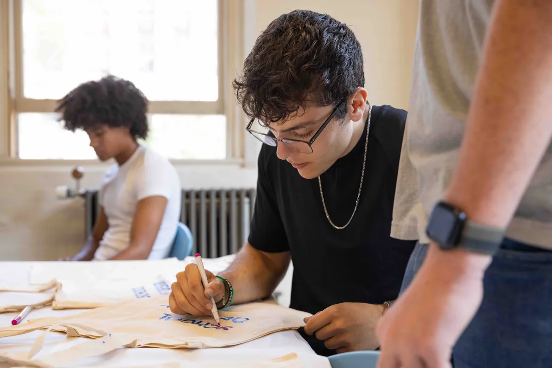 First Year School of Design students meet and work on a screen printing project together.