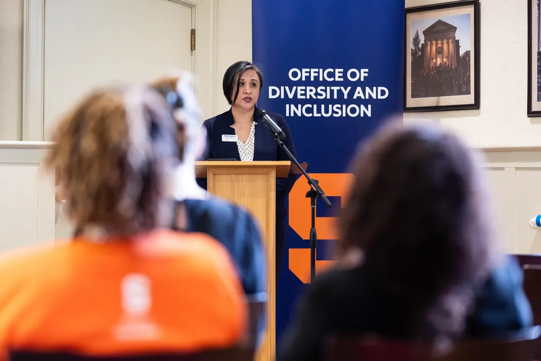 Mary Grace Almandrez speaking at event.