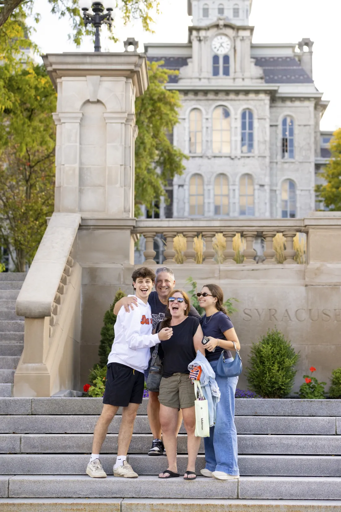 People standing together to pose for pictures.
