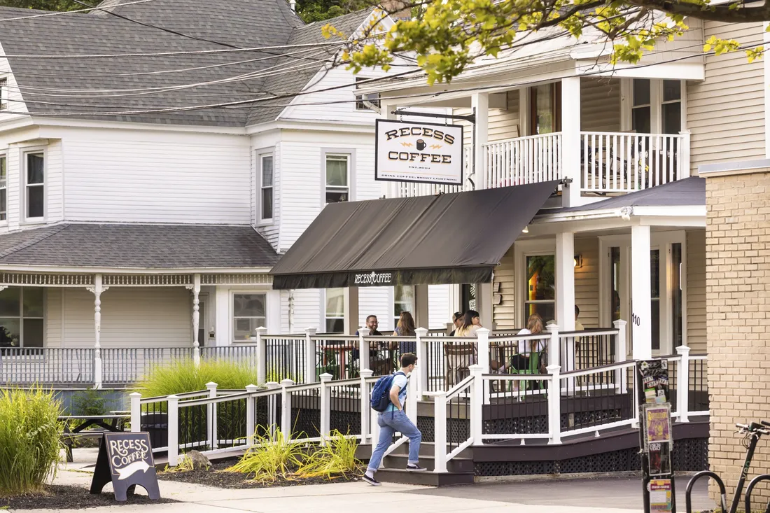 People walking in to Recess Coffee in Westcott.