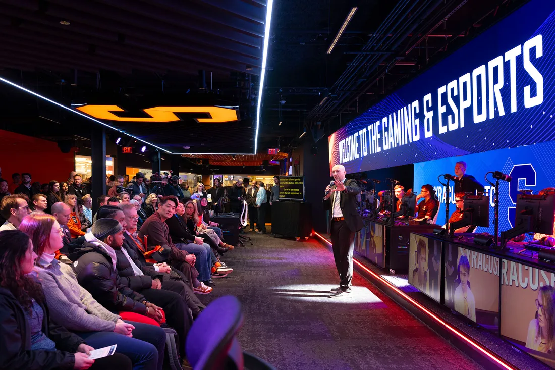 Person hosting an eSports tournament and speaking to the crowd before the games begin.