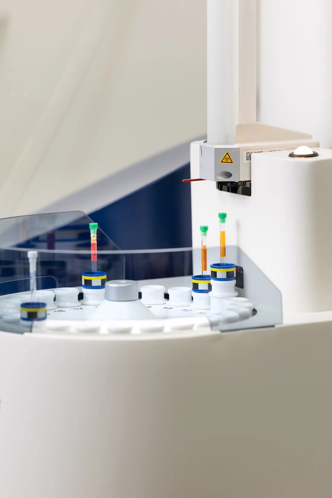 A white tray inside of a magnetic spectrometer in a lab.