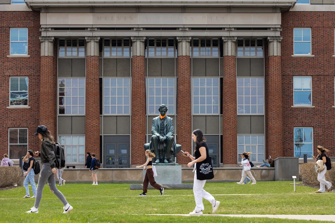 Students walking outside on campus.