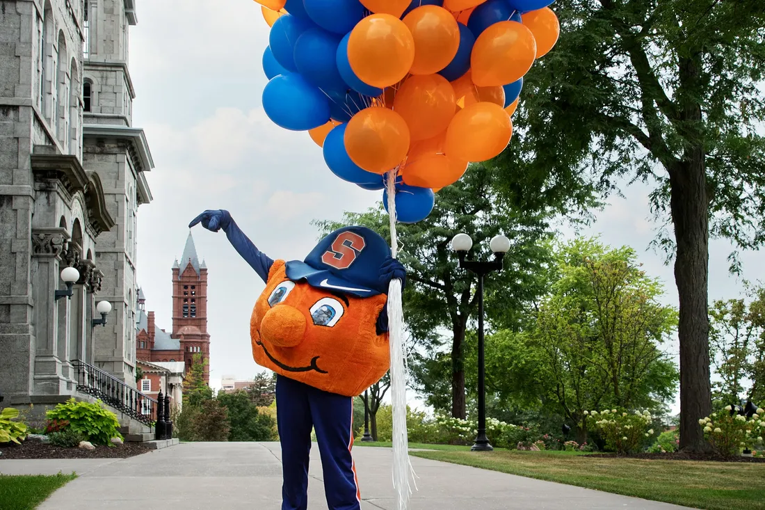 Otto the Ornage with balloons.