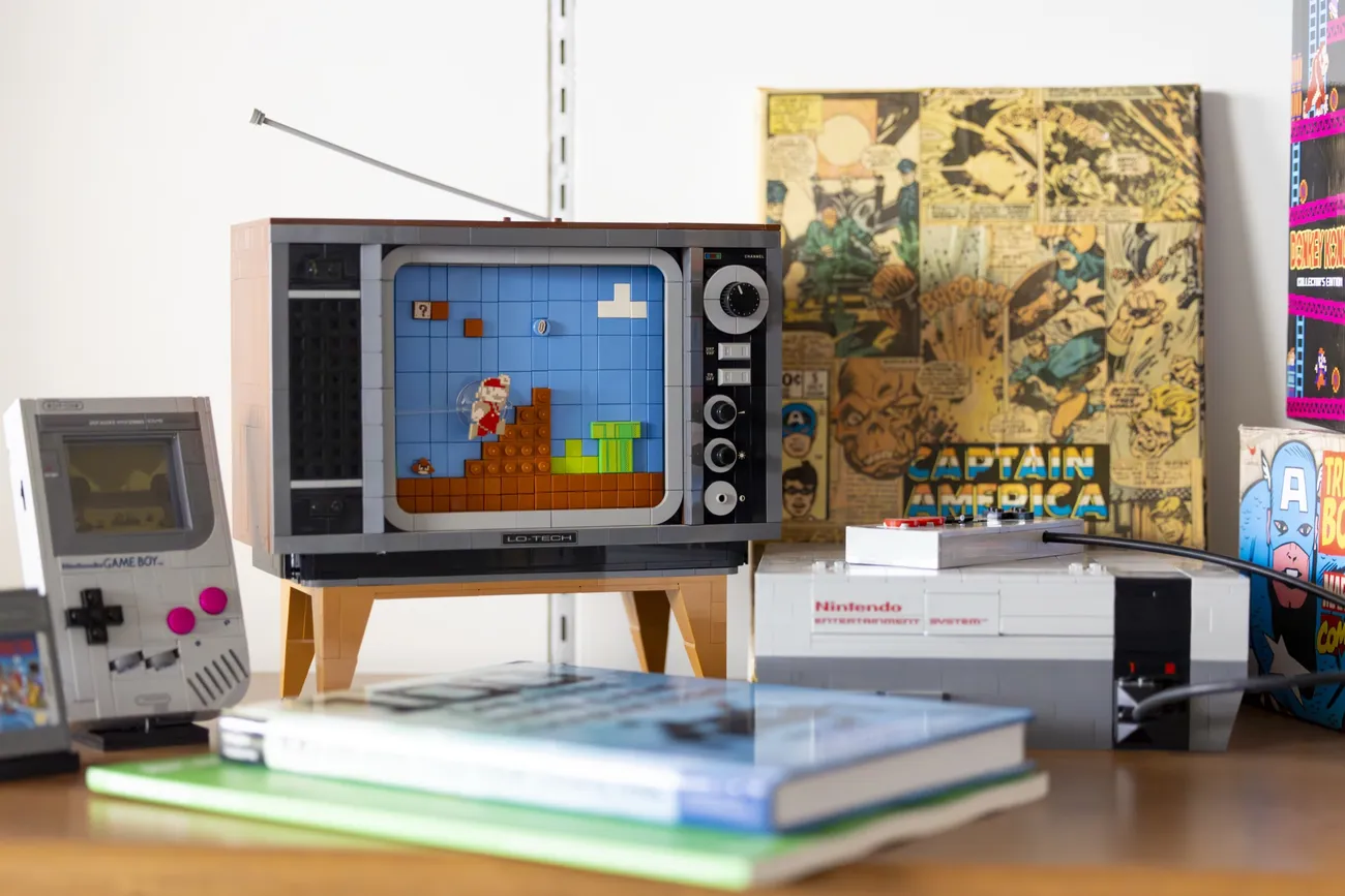 Close up of video game and comic book art on a desk.