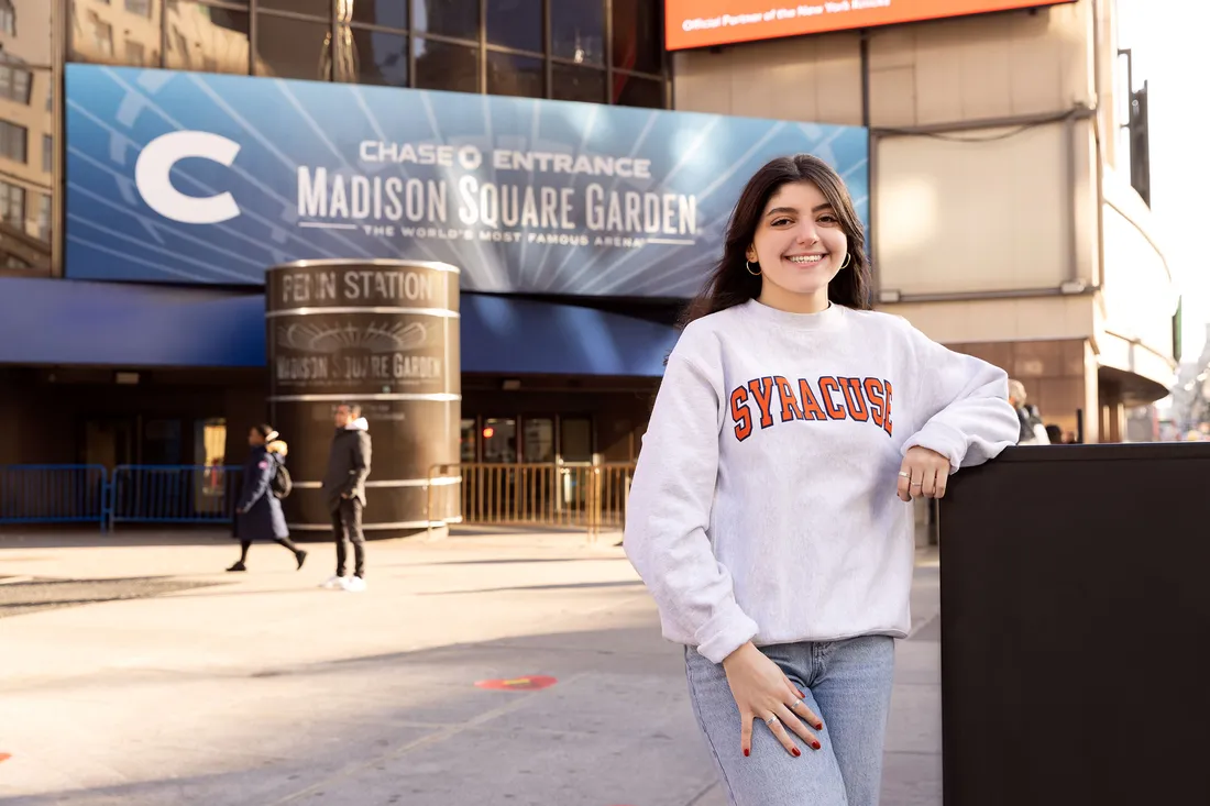 Person standing outside Madison Square Garden.