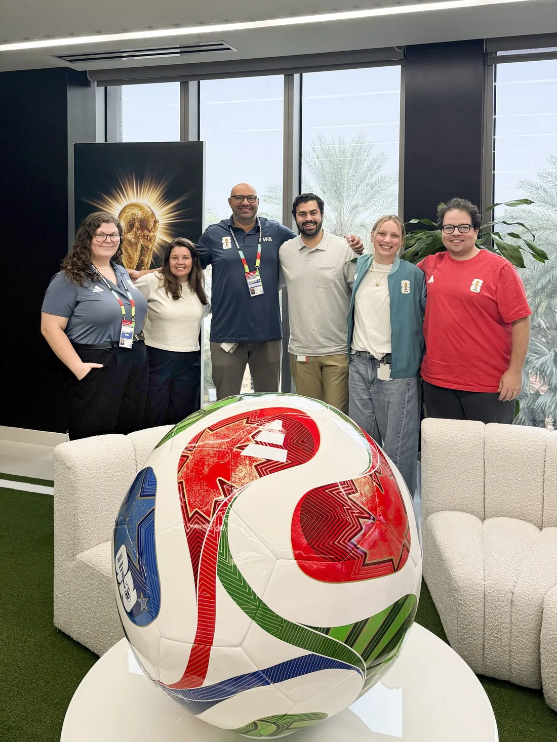 Alumnus Raj Saha standing with colleagues from FIFA.