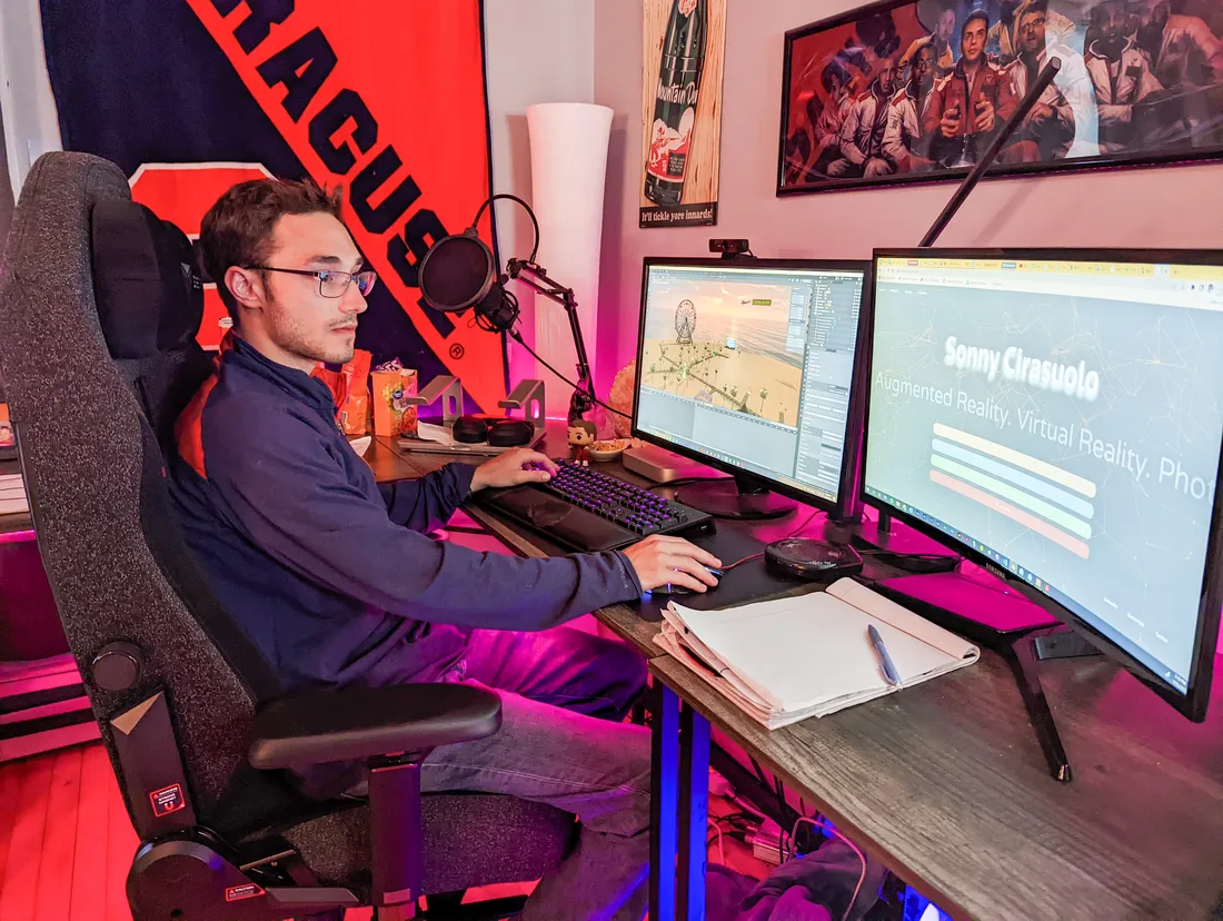 Sonny Cirasuolo working on computer with two monitors.