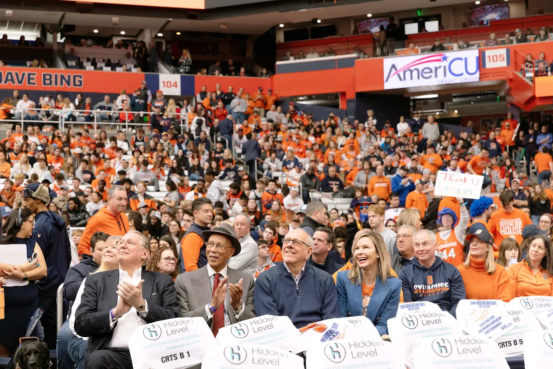 Jim Boeheim and David Bing sitting.