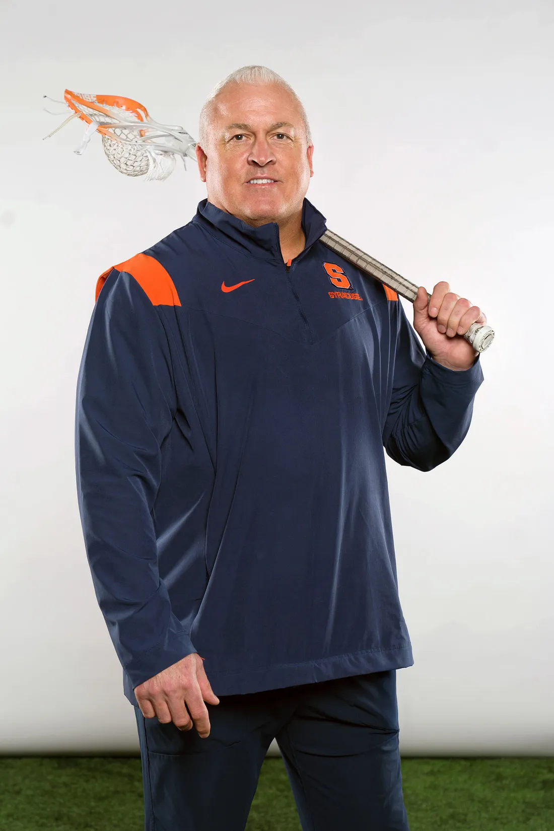 Gary Gait standing with a lacrosse stick.