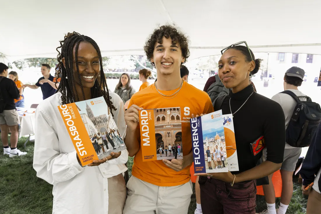 Students smiling at abroad on the quad event.