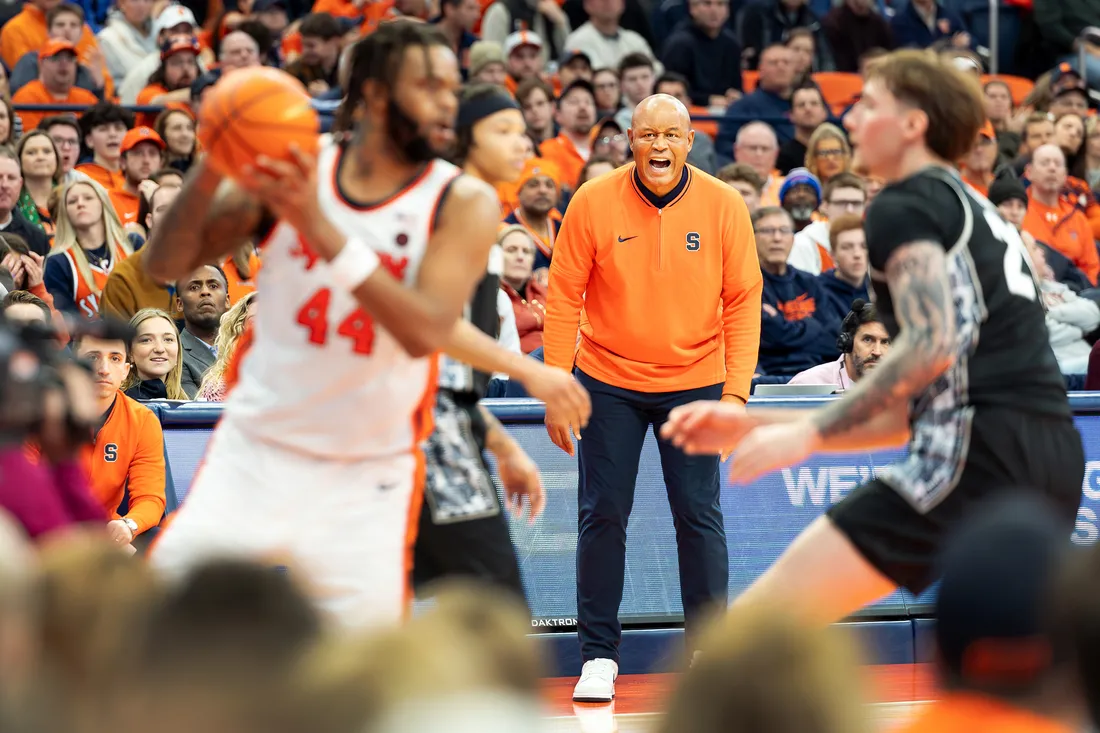 Coach screaming at team on sidelines.