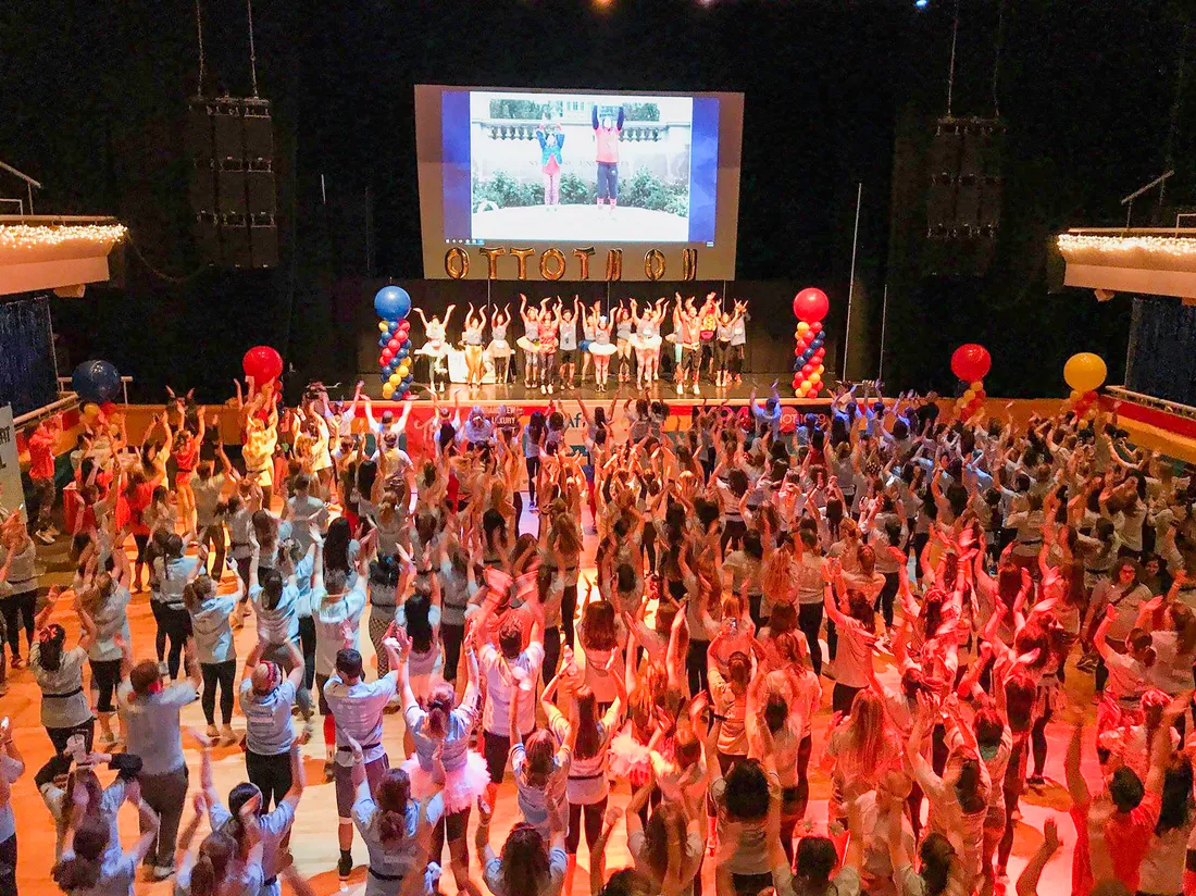 A crowd of students dancing, shot from overhead.