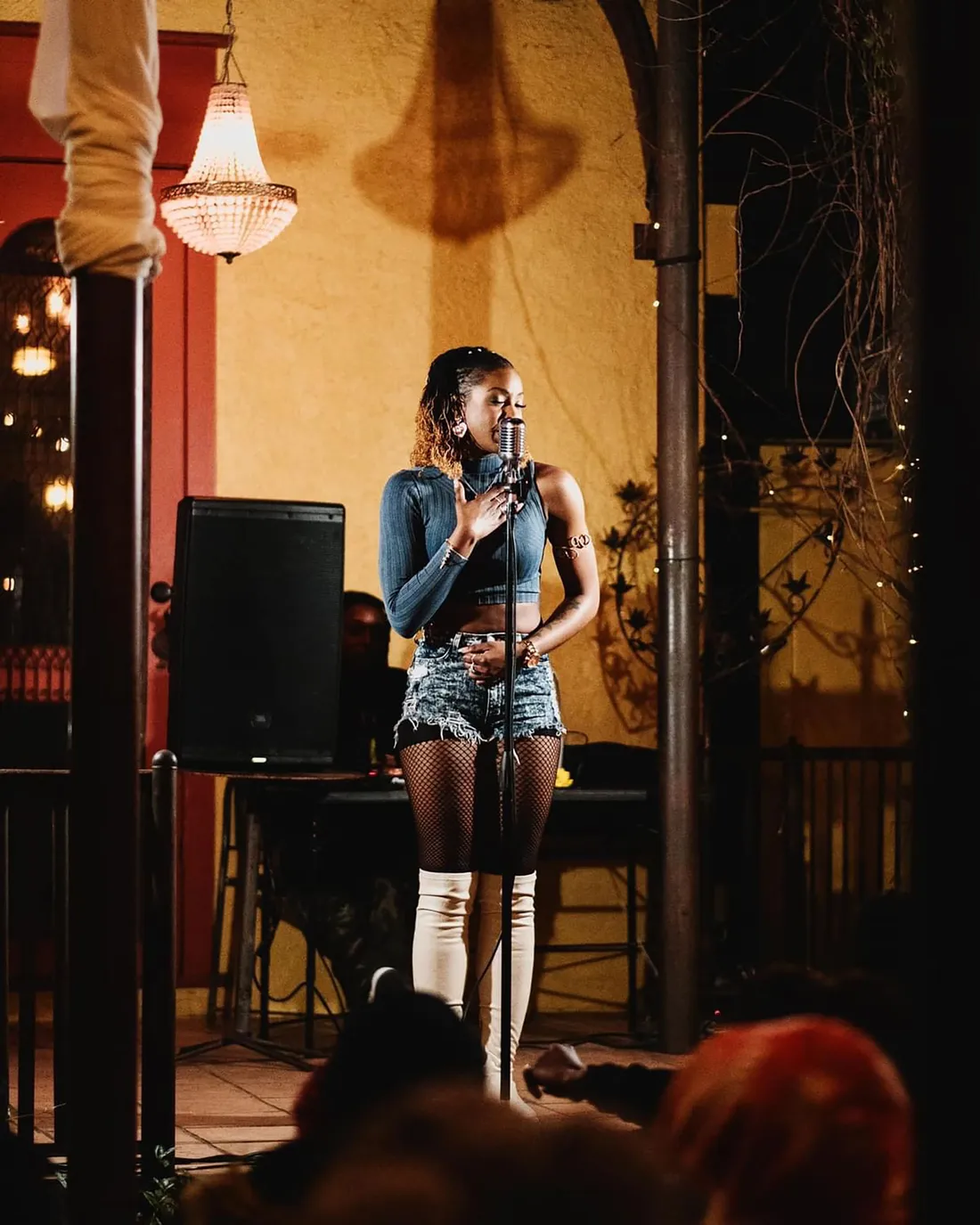 Imani Wallace on a stage performing.