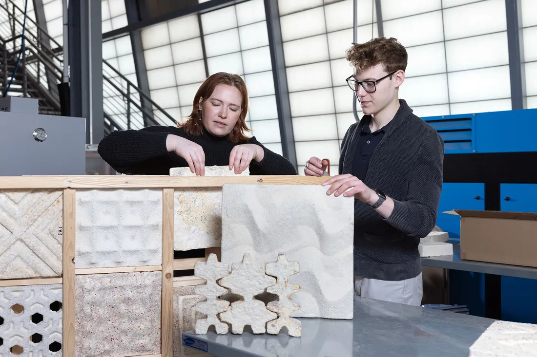 Two students working together on a project.