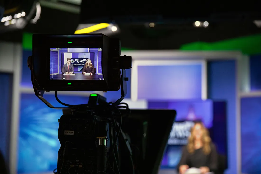 Students in a TV studio.