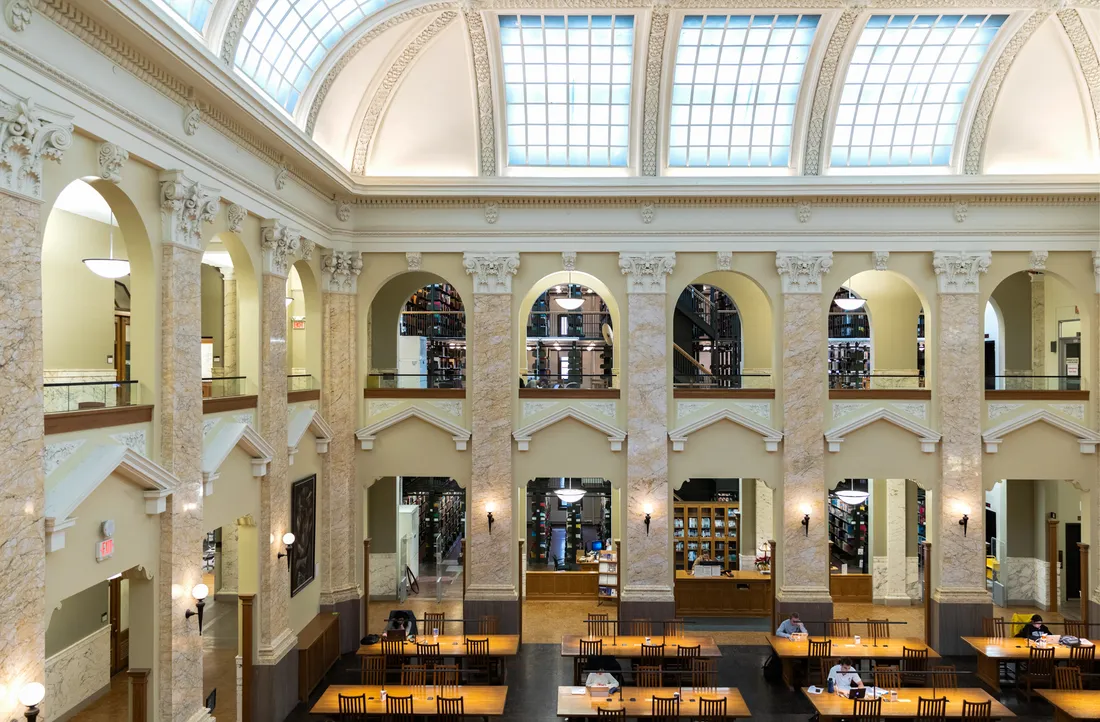 View of interior of a library with large, open central area