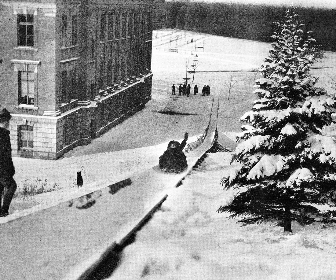 Students toboggan down mount Olympus.