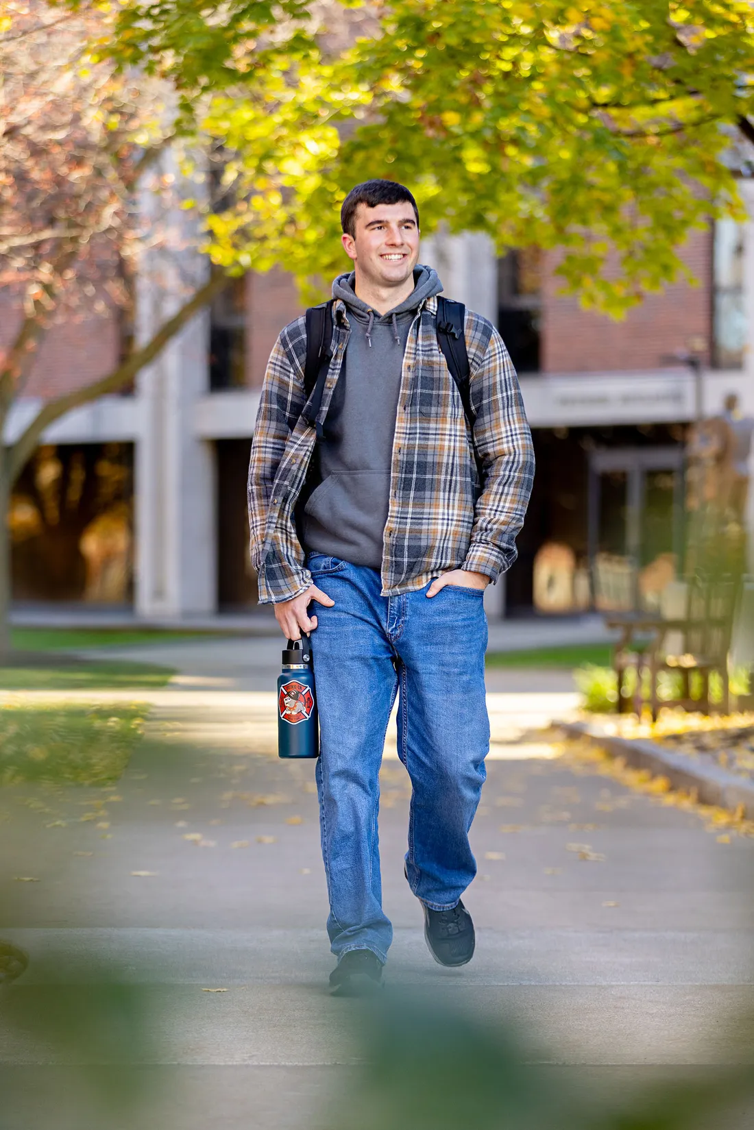 Ryan Derkowski walking on campus.