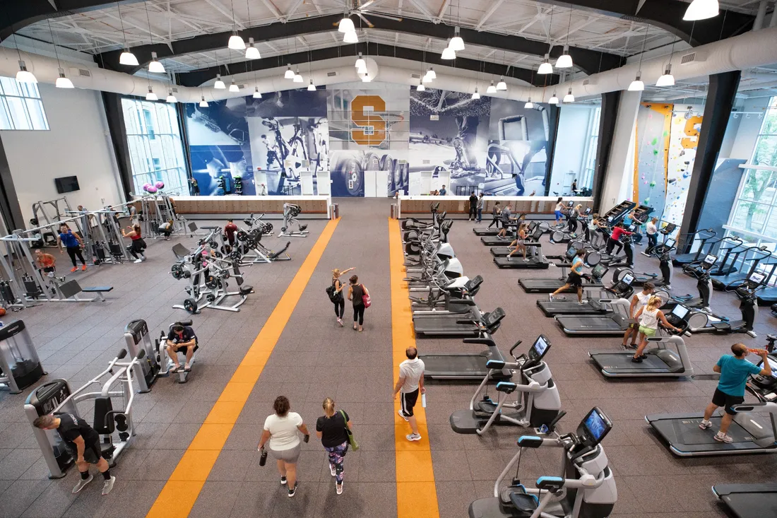 Overhead view of fitness facility with people using weight training and cardio machines