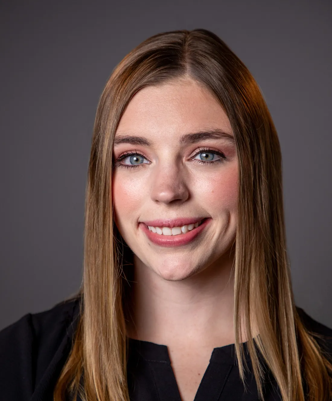 Hannah Williams smiling in a black shirt.