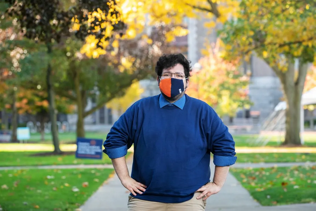 Syracuse University student, Kevin Camelo, on the quad outside of ischool.