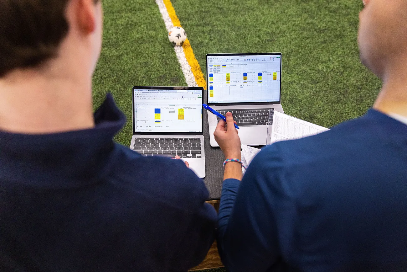 Two students looking at a laptop.