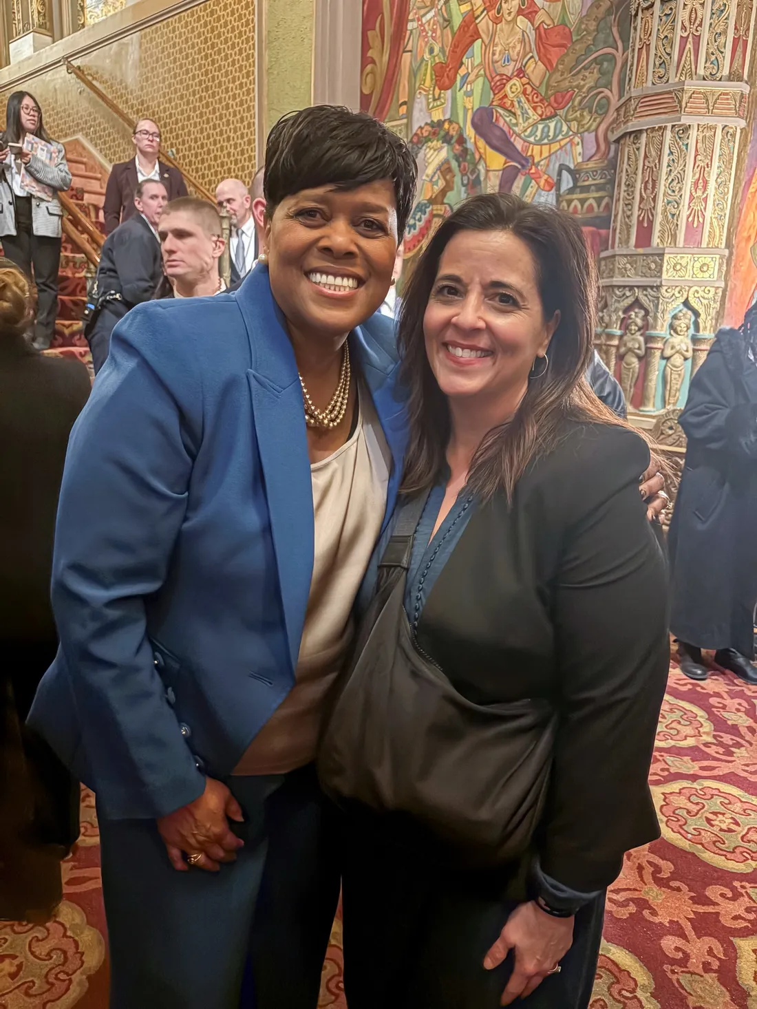 Sharon Owens posing and smiling with her Chief Strategy Officer Stephanie Pasquale ’94, G’97 at Mayor Owens' inauguration.