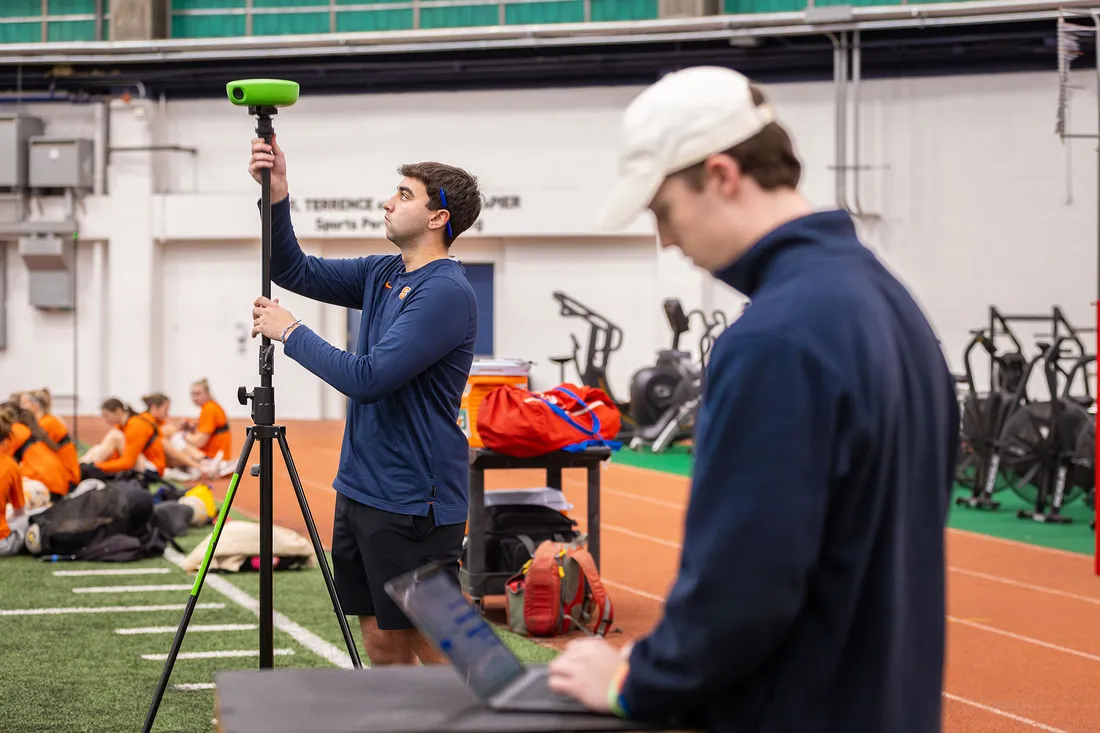 Ian MacMiller setting up surveying equipment.
