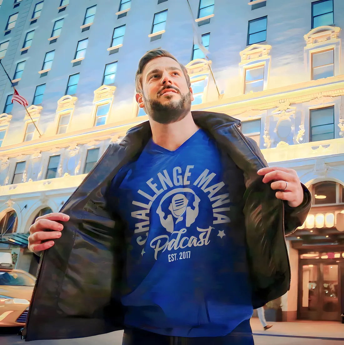 Person holding jacket open to show tshirt while looking up at the sky.