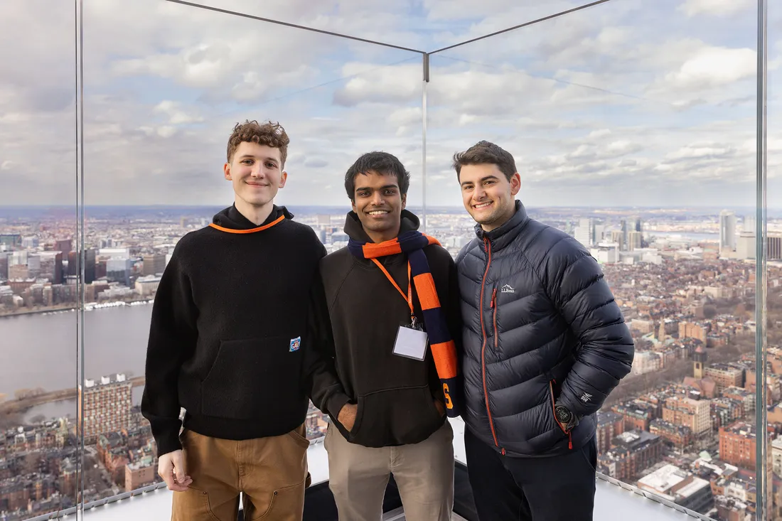 Three Syracuse University students at the top of the Prudential Center.
