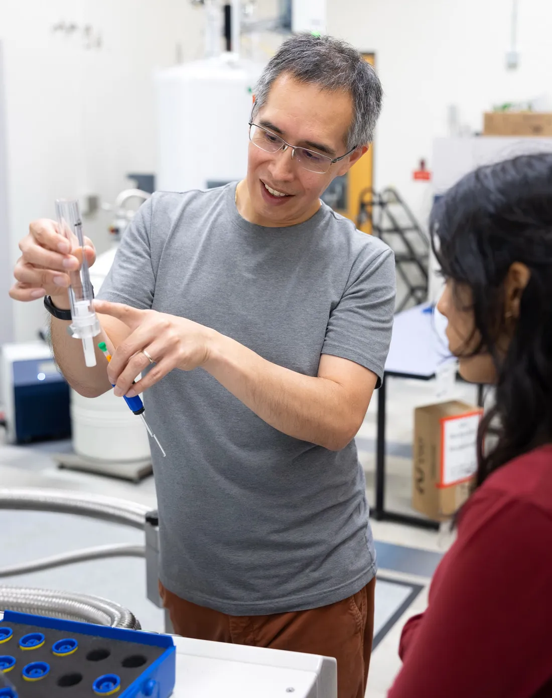 Carlos Castañeda showing his students a laboratory syringe.
