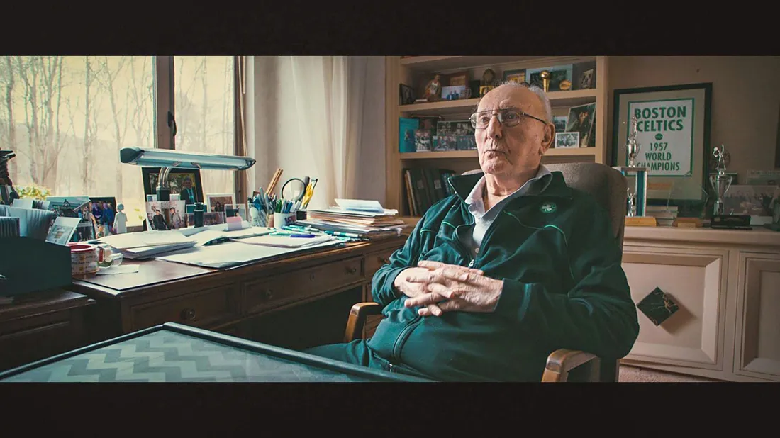 An image of Bob Cousy during a interview.