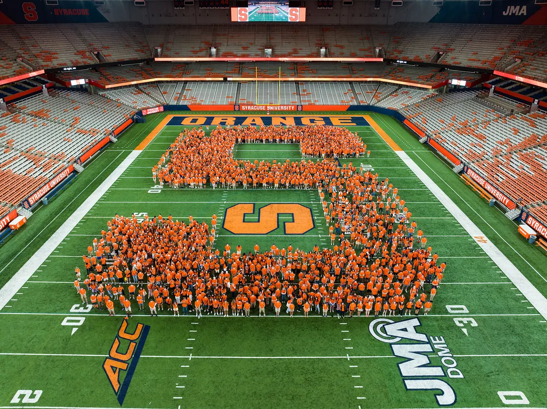 Students form Block S shape on dome field.