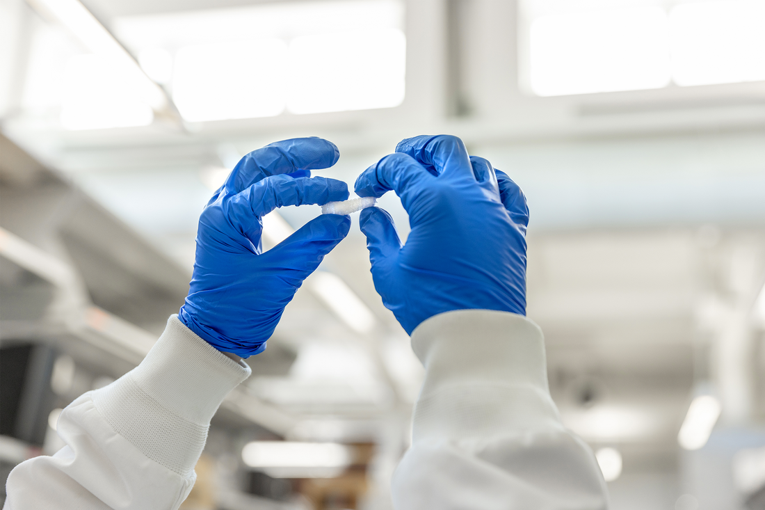 Professor Mary Beth Monroe working in lab.