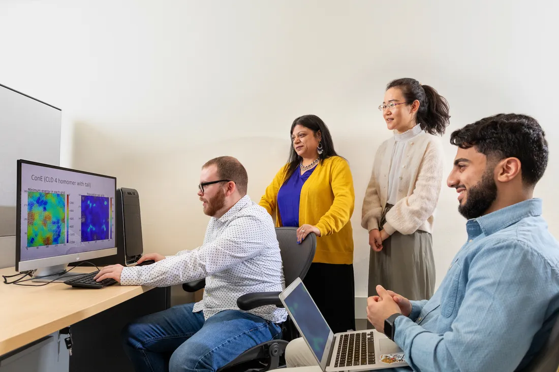 People sitting at a computer.