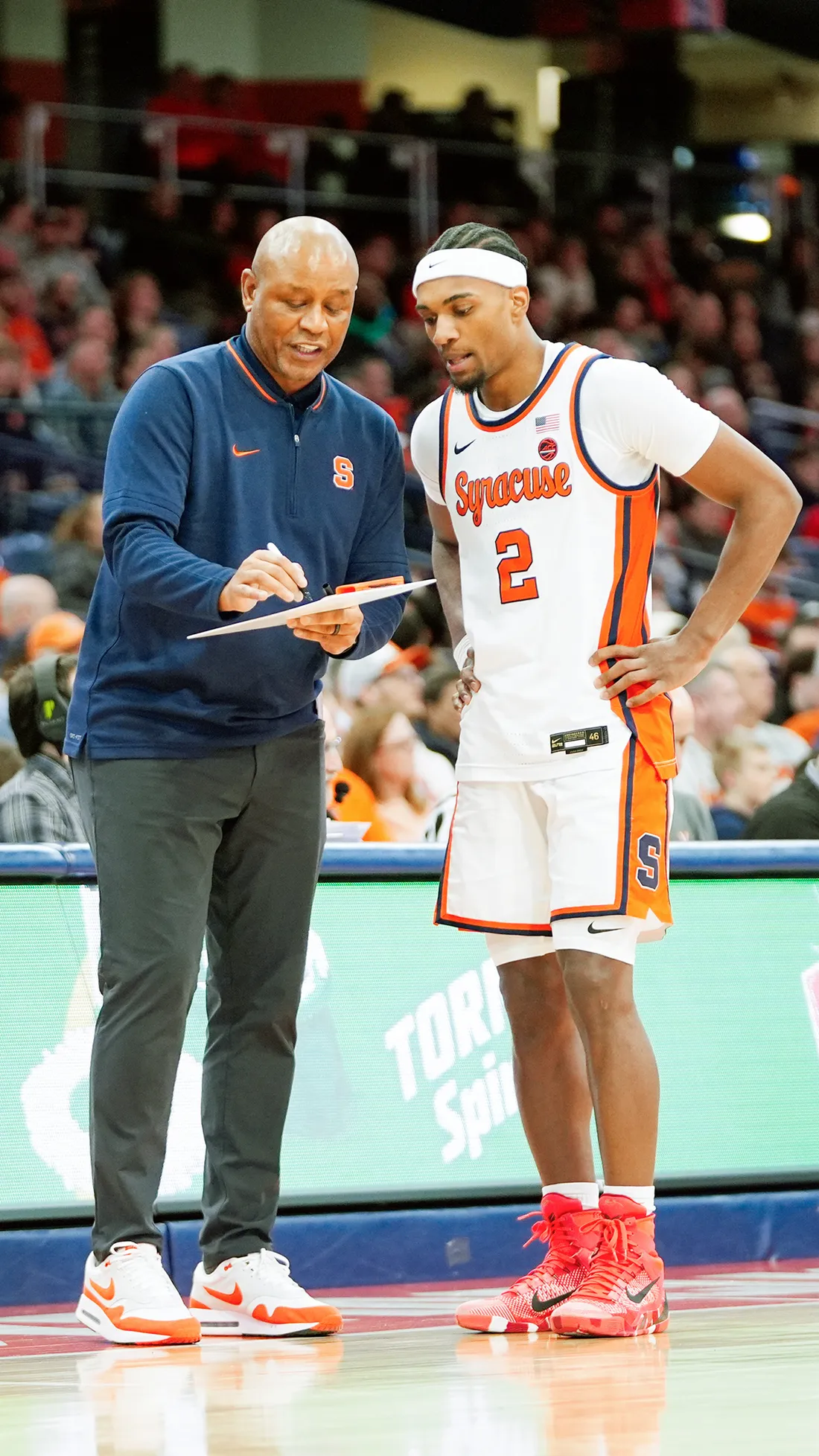 Person coaching player.
