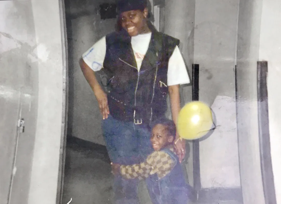 A childhood photo of George Lynch hugging his mother.