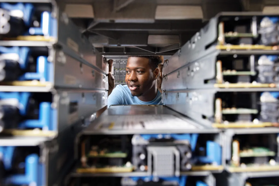 A student working on a computer system.