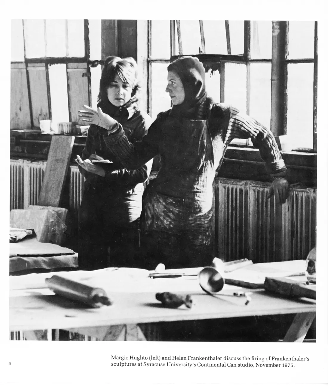 Helen Frankenthaller and Professor Margie Hughto talking in an art studio.