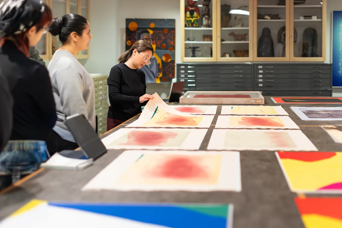 Professor looking at prints