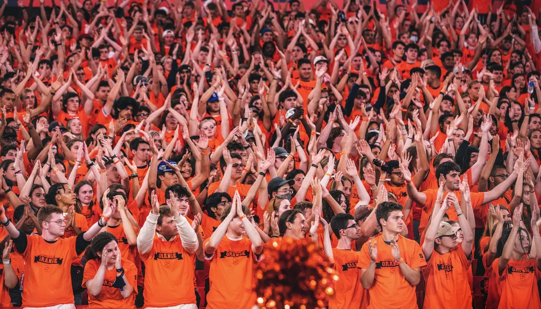 Photo of fans cheering in the stands.