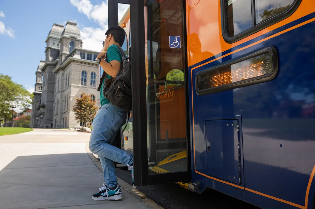 Student getting off the bus.