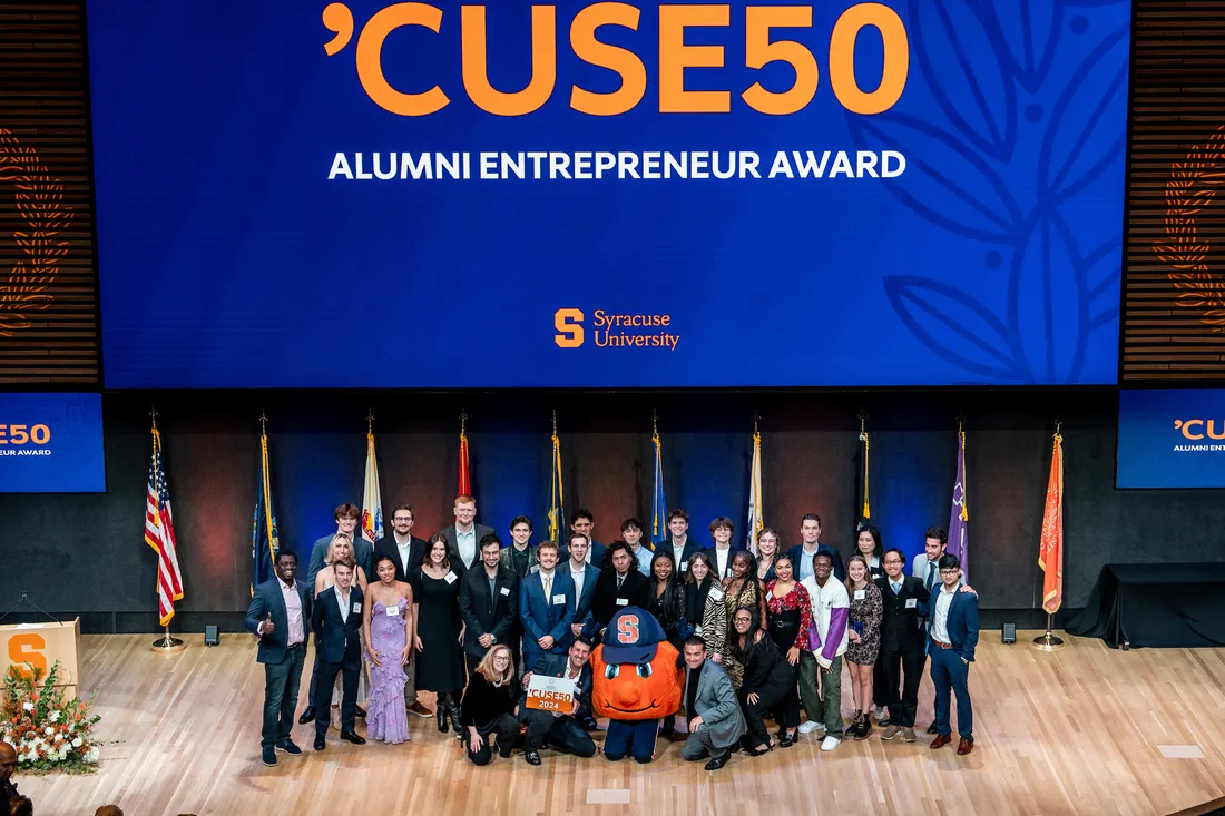 Cuse 50 2024 group together and smiling.