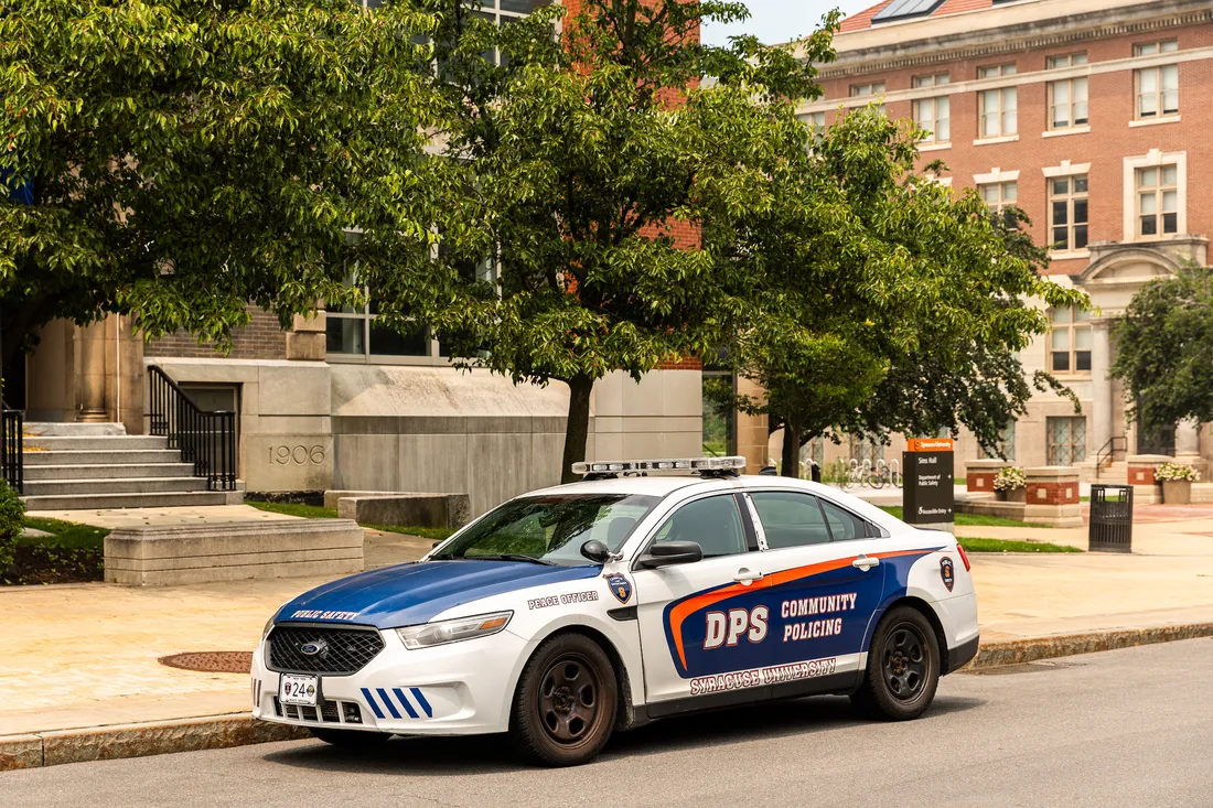 A public safety car parked outside of a building.
